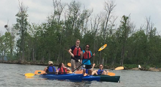 interns on a kayak trip