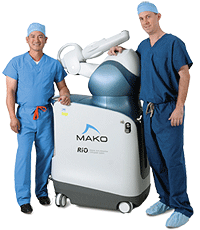 two surgeons with MAKO machine