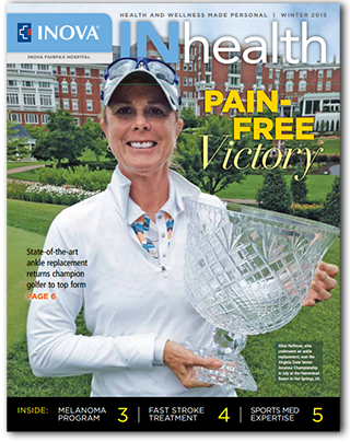 Magazine cover: woman smiling, holding a trophy. Headline says 'Pain Free Victory'