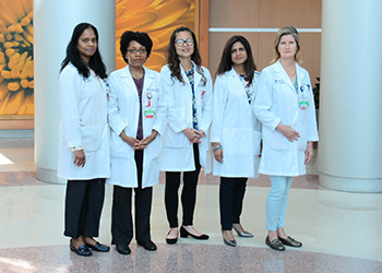 group photo of five geriatrics services doctors