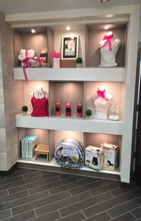 photo of nicely decorated shelves with breastfeeding supplies