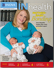 magazine cover showing a mother holding her two infants